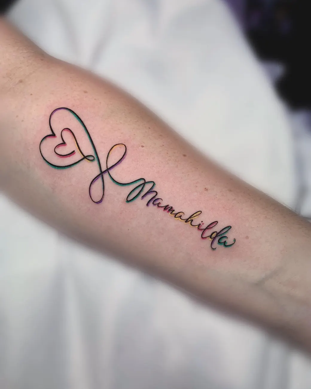 Tatuaje: Nombre con corazón, antebrazo